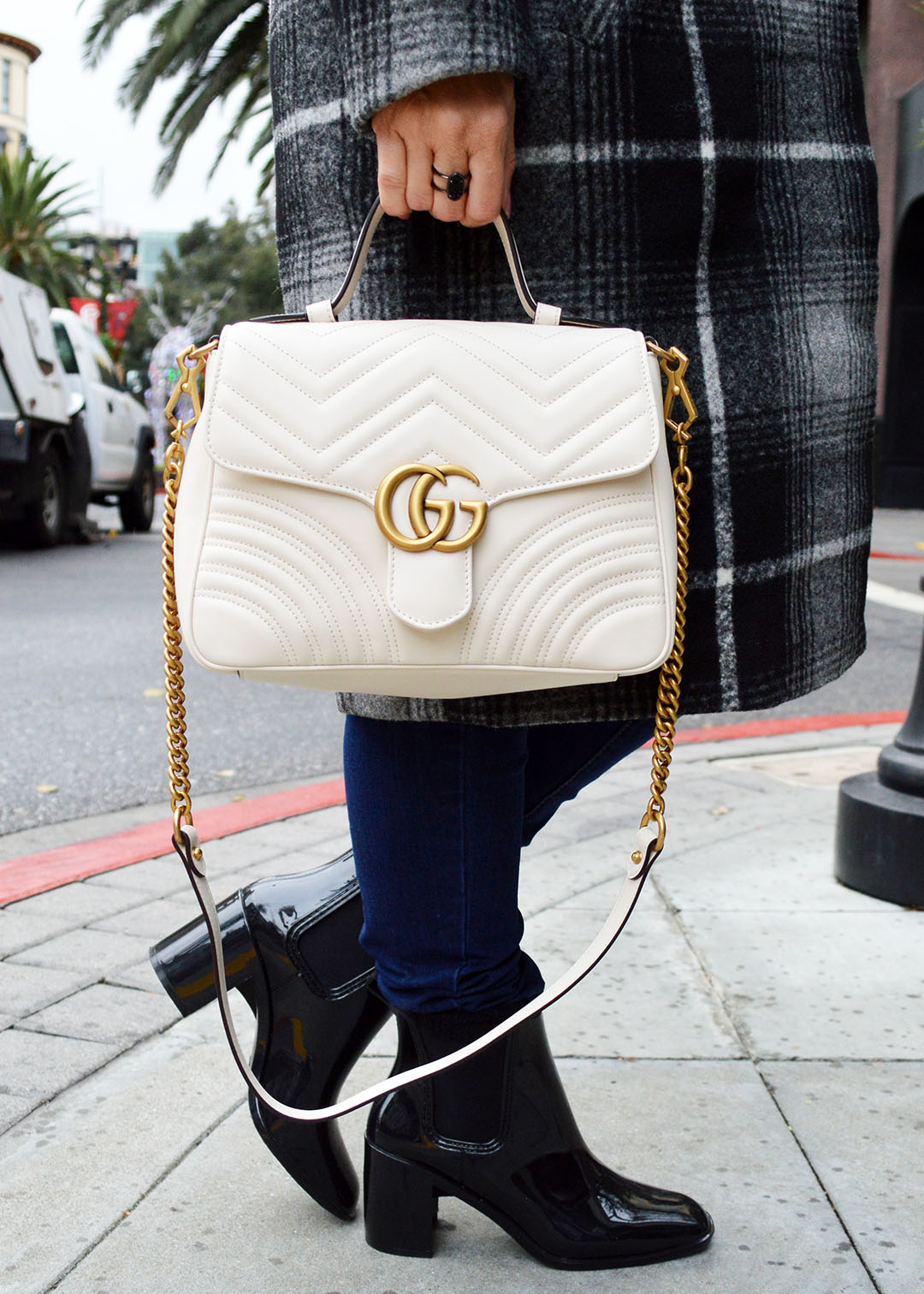 gucci bag and rain boots