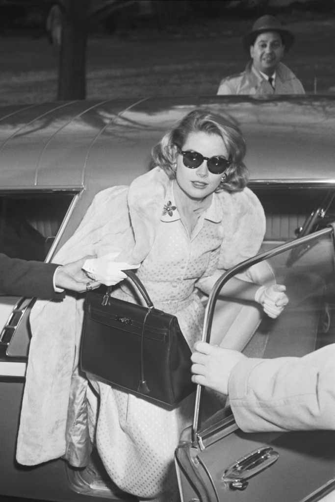 Grace Kelly (American Actress) Holding Hermès Kelly Bag, Classic Moment of the Iconic Bag's Origin