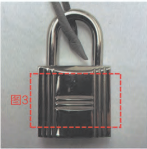 Hermès lock mechanism labeled as "3" – authentication detail for luxury bag hardware.