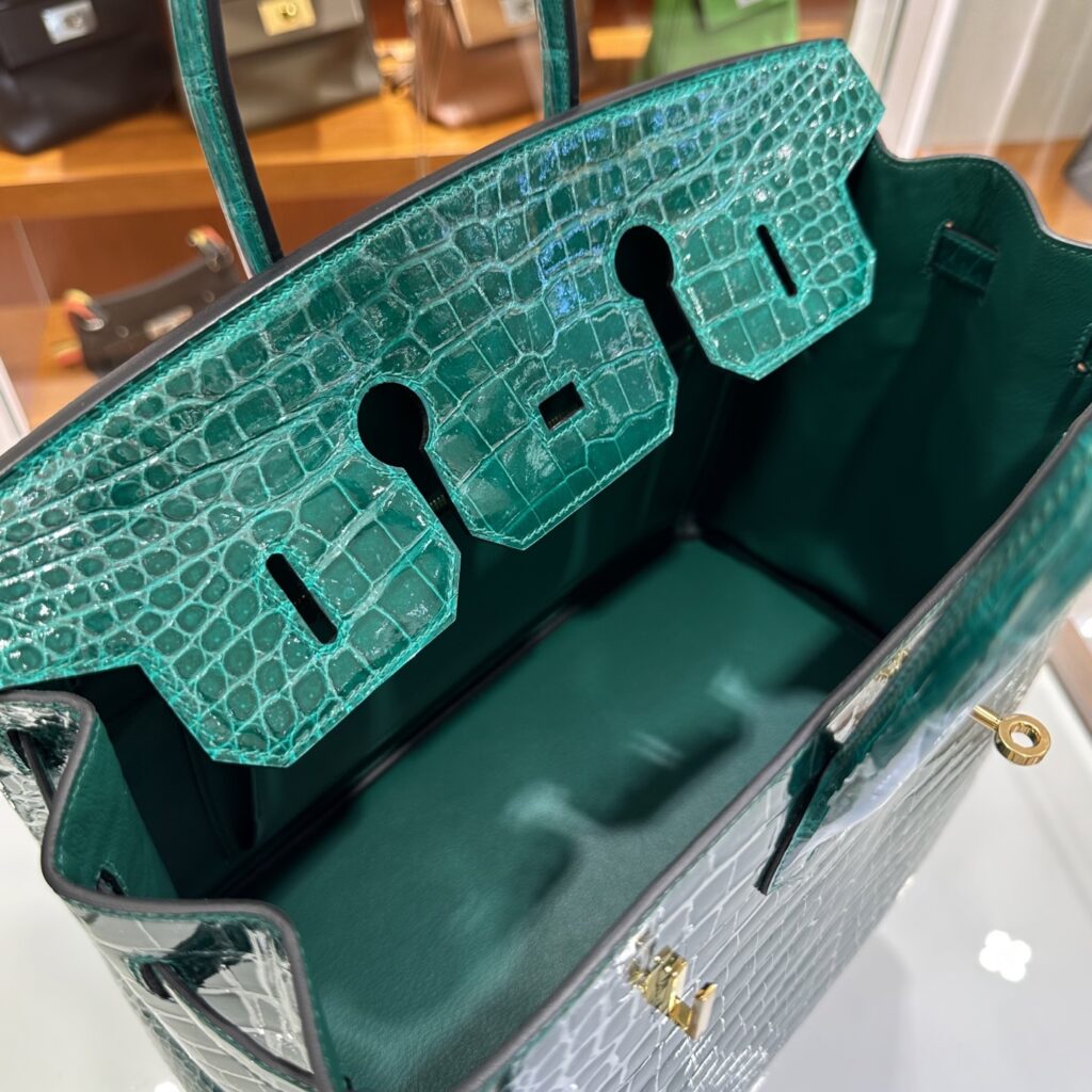 Interior view of a fully handmade Hermes Birkin 35 Porosus replica showing flawless leather lining and hardware cutouts.