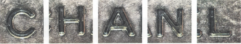  Replica Sunglasses Chanel interior metal logo plate secured with standard flathead screws, a crucial detail to Chanel authenticate the bag's hardware.