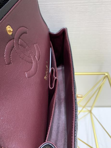 nterior view of a superfake Chanel Classic Flap featuring burgundy lambskin lining, compartments, and the stitched CC logo, demonstrating expert details in replica chanel designer bags.